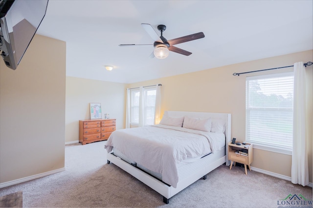 1202 Santa Cruz Dr, Longview, TX 75601 - carpeted bedroom with baseboards and ceiling fan