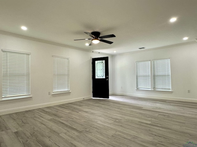 209 E Edgefield Ave, Longview, TX 75602 - entrance foyer featuring crown molding, wood finished floors, ceiling fan, and recessed lighting