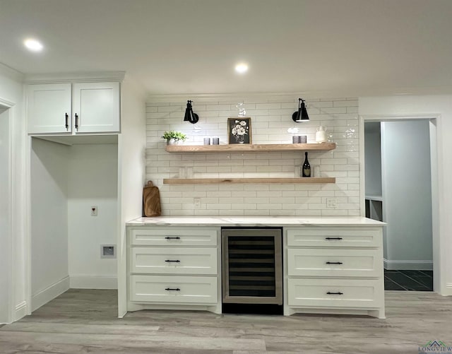 209 E Edgefield Ave, Longview, TX 75602 - indoor dry bar with beverage cooler, backsplash, light wood-style flooring, and recessed lighting