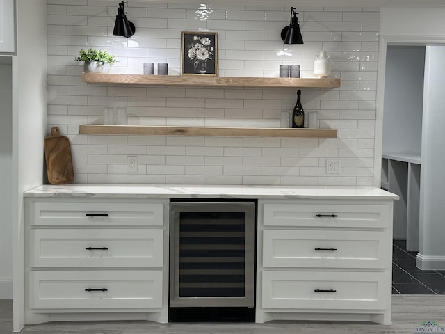 209 E Edgefield Ave, Longview, TX 75602 - indoor dry bar featuring beverage cooler and decorative backsplash