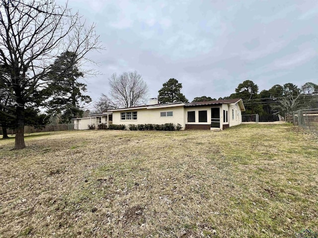 exterior space featuring a front lawn