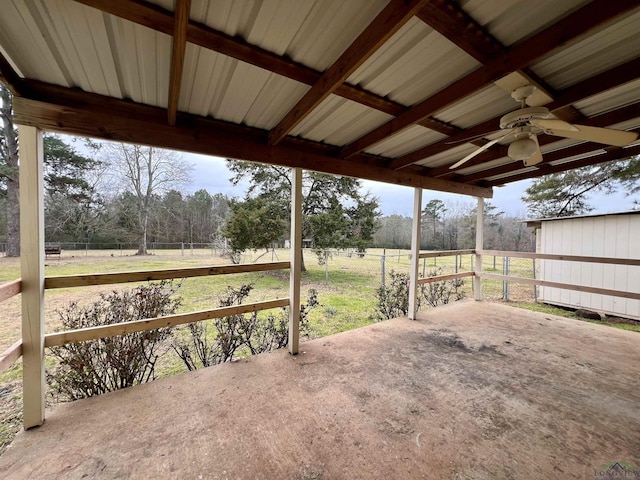 view of patio / terrace featuring a rural view and ceiling fan