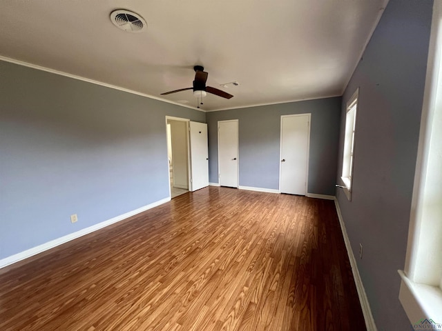 unfurnished bedroom featuring ornamental molding, ceiling fan, and light hardwood / wood-style flooring