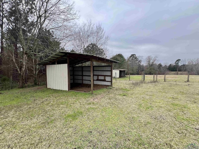 view of outdoor structure featuring a yard