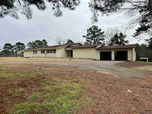 ranch-style home with a garage