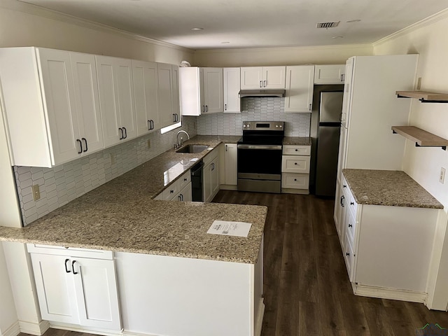 kitchen featuring stainless steel appliances, ornamental molding, white cabinets, and backsplash