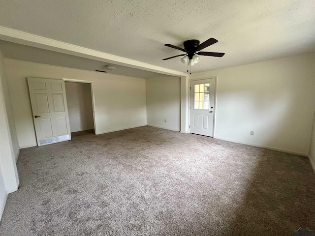 carpeted empty room with a textured ceiling and ceiling fan