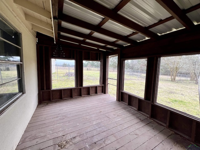 unfurnished sunroom with vaulted ceiling