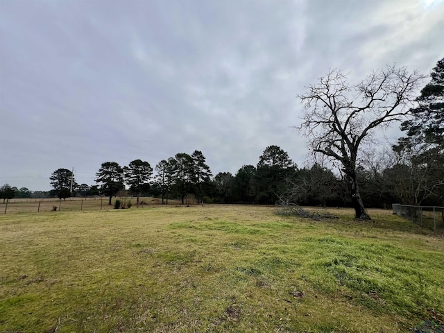 view of yard with a rural view