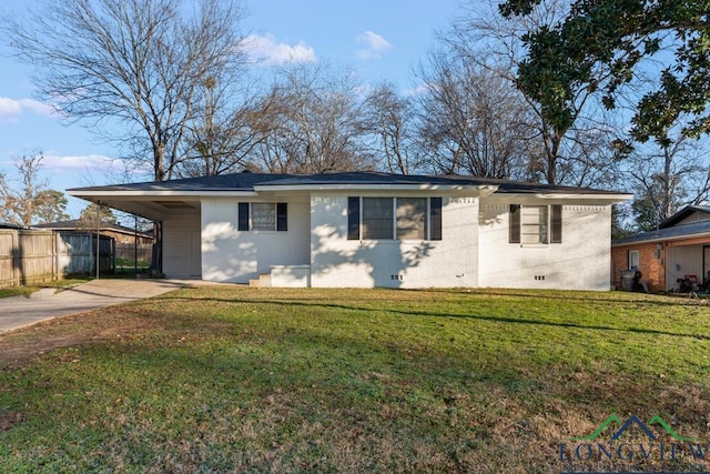 ranch-style home with a carport and a front yard