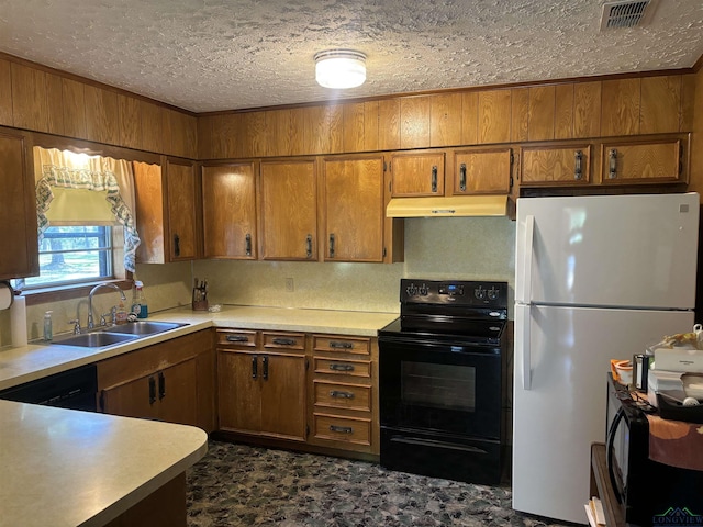 kitchen with sink, a textured ceiling, wooden walls, black appliances, and ornamental molding