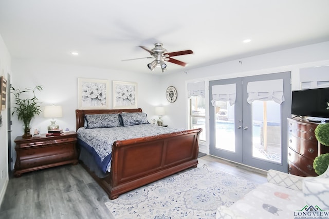 bedroom with access to exterior, recessed lighting, wood finished floors, and french doors