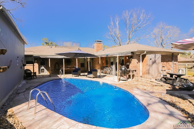 view of pool featuring a patio, fence, and a fenced in pool