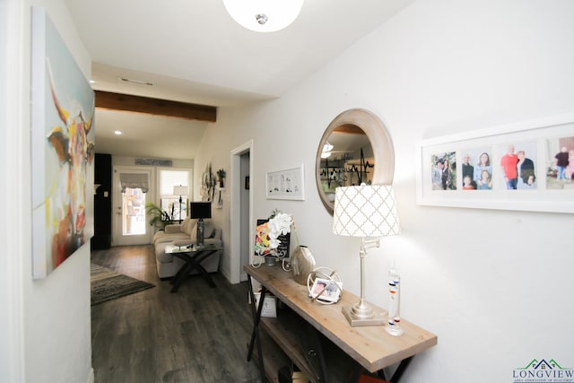 hall featuring lofted ceiling with beams and dark wood-style flooring