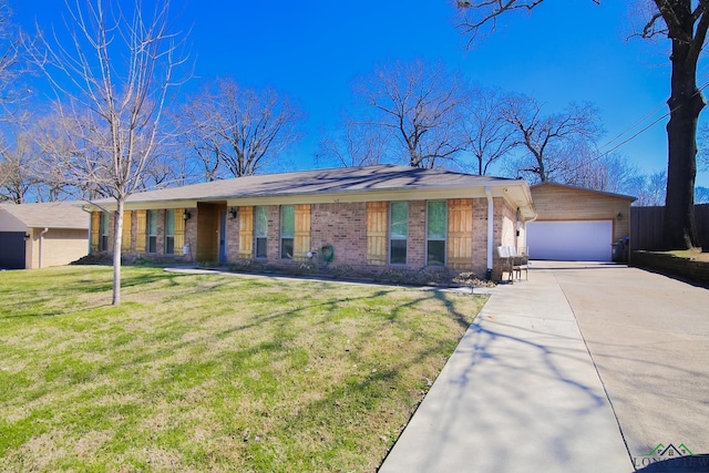 ranch-style house with a garage, brick siding, an outdoor structure, driveway, and a front lawn