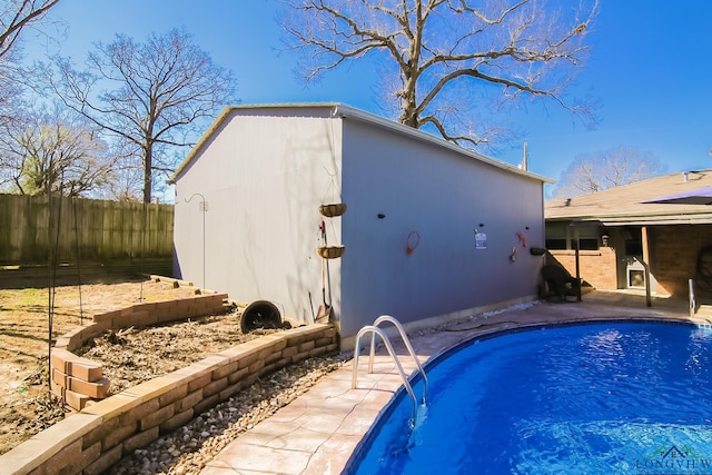 view of pool featuring a patio area, fence, and a fenced in pool