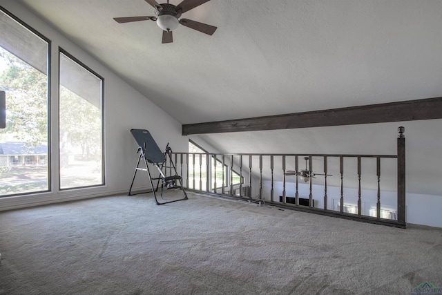 interior space featuring lofted ceiling with beams and ceiling fan