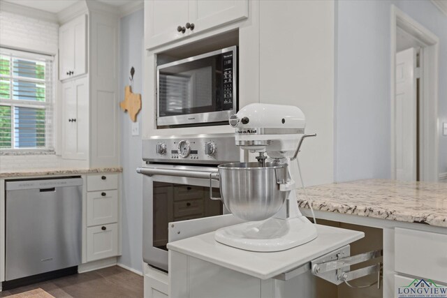 204 Delwood Dr, Longview, TX 75605 - kitchen featuring appliances with stainless steel finishes, white cabinetry, light stone counters, and baseboards