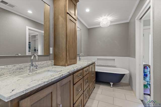 204 Delwood Dr, Longview, TX 75605 - full bath with crown molding, double vanity, tile patterned flooring, a freestanding tub, and a chandelier