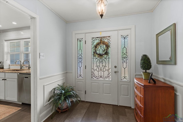 204 Delwood Dr, Longview, TX 75605 - entryway featuring dark wood finished floors, ornamental molding, and a wainscoted wall