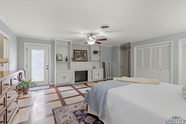 204 Delwood Dr, Longview, TX 75605 - bedroom featuring inlaid floor details, access to exterior, ornamental molding, multiple closets, and a fireplace with flush hearth