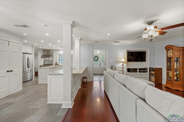 204 Delwood Dr, Longview, TX 75605 - living room featuring ornamental molding, a ceiling fan, recessed lighting, light wood-type flooring, and ornate columns