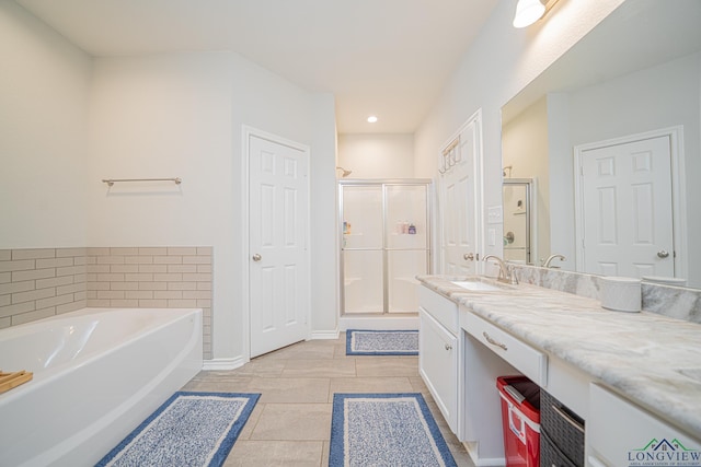 bathroom with vanity, tile patterned floors, and independent shower and bath