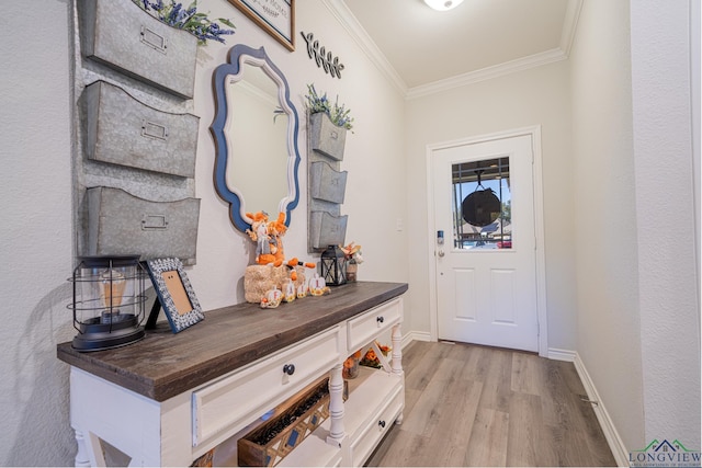 foyer entrance featuring light wood-type flooring and crown molding