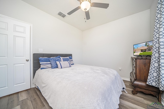 bedroom featuring wood-type flooring and ceiling fan