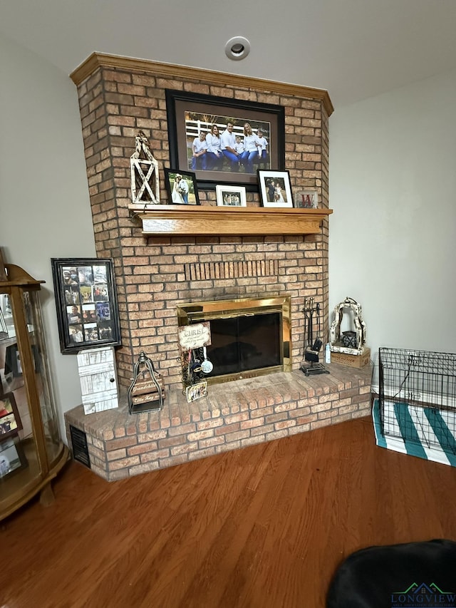 302 Meadowbrook Ln, Ore City, TX 75683 - living room featuring a brick fireplace and wood finished floors