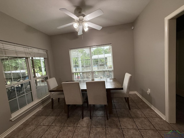 302 Meadowbrook Ln, Ore City, TX 75683 - dining room with dark tile patterned floors, ceiling fan, and baseboards