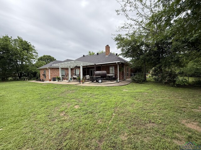302 Meadowbrook Ln, Ore City, TX 75683 - back of property featuring a patio area, a chimney, brick siding, and a pergola