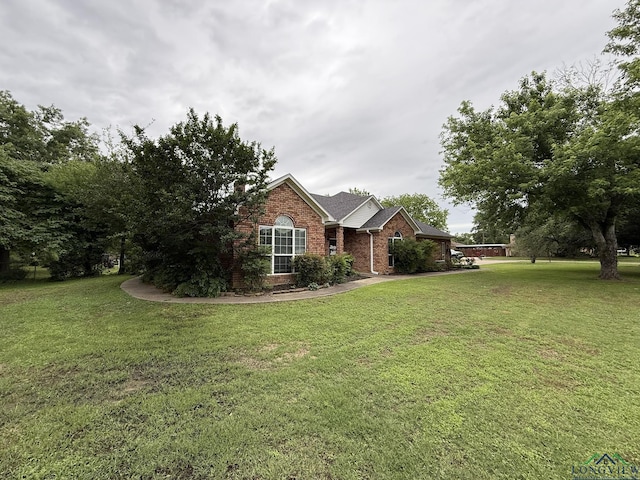 302 Meadowbrook Ln, Ore City, TX 75683 - view of front of house with brick siding and a front lawn
