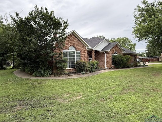 302 Meadowbrook Ln, Ore City, TX 75683 - view of front of property featuring brick siding, a front yard, and a chimney