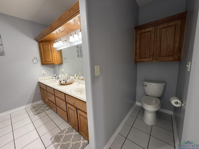 302 Meadowbrook Ln, Ore City, TX 75683 - bathroom featuring tile patterned floors, toilet, baseboards, and double vanity