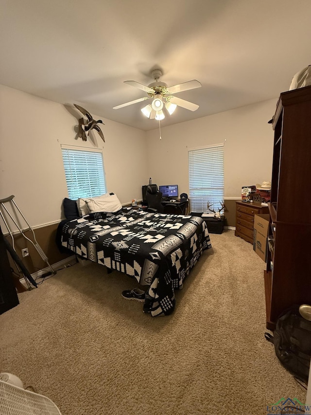 302 Meadowbrook Ln, Ore City, TX 75683 - bedroom with light colored carpet and ceiling fan