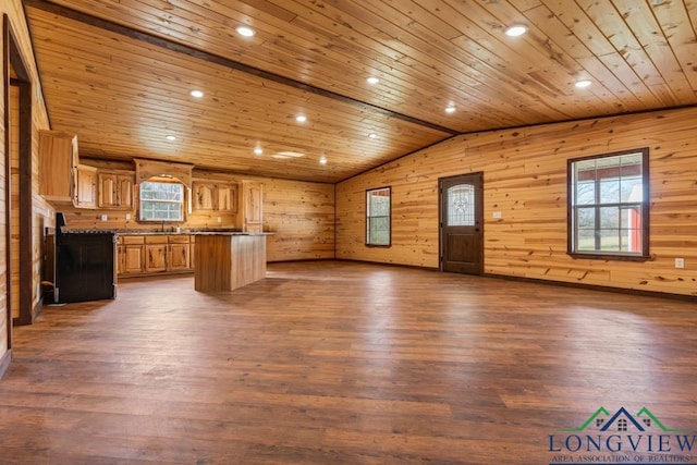 kitchen featuring a kitchen island, dark wood-type flooring, vaulted ceiling, wood ceiling, and open floor plan