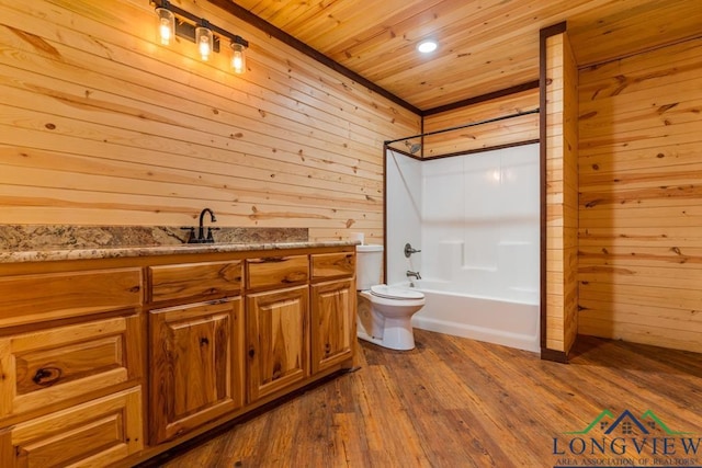 bathroom with vanity, hardwood / wood-style flooring, wood ceiling, wood walls, and toilet