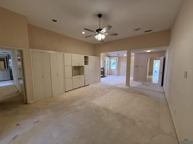 unfurnished bedroom with light carpet and ceiling fan