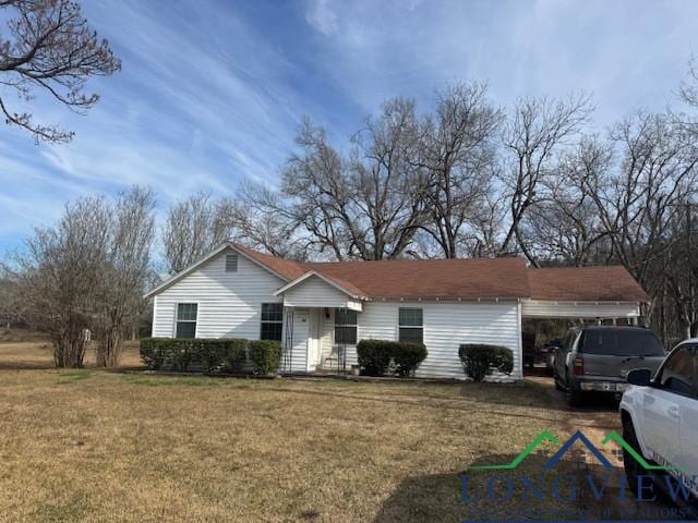 single story home with an attached garage and a front yard