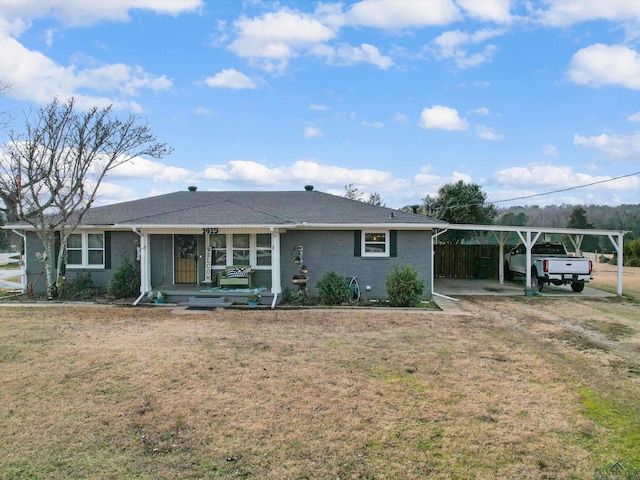 ranch-style house featuring a carport, covered porch, and a front lawn