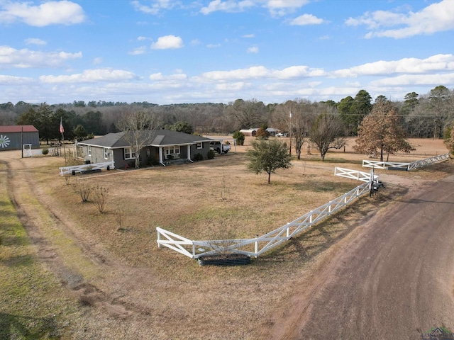 birds eye view of property featuring a rural view