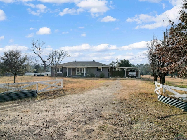 view of front of property featuring a carport