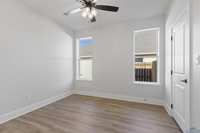 unfurnished room featuring ceiling fan and light hardwood / wood-style flooring