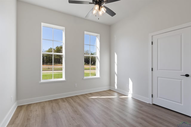 unfurnished room featuring light hardwood / wood-style flooring and ceiling fan