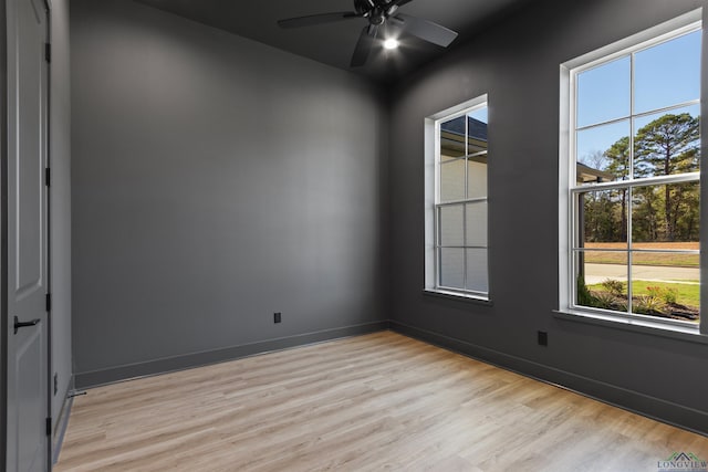 spare room with light hardwood / wood-style floors and ceiling fan