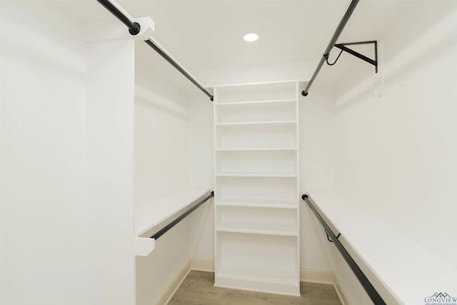 walk in closet featuring light hardwood / wood-style floors