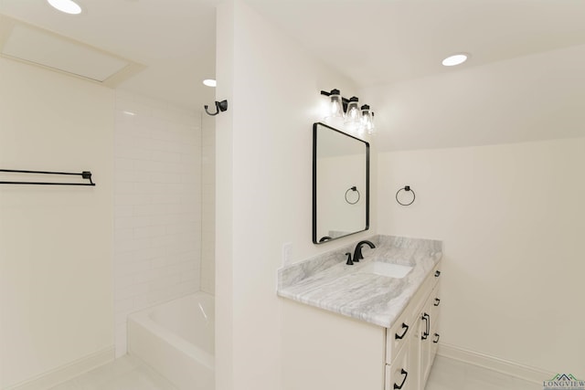 bathroom featuring tile patterned floors, vanity, and tiled shower / bath combo