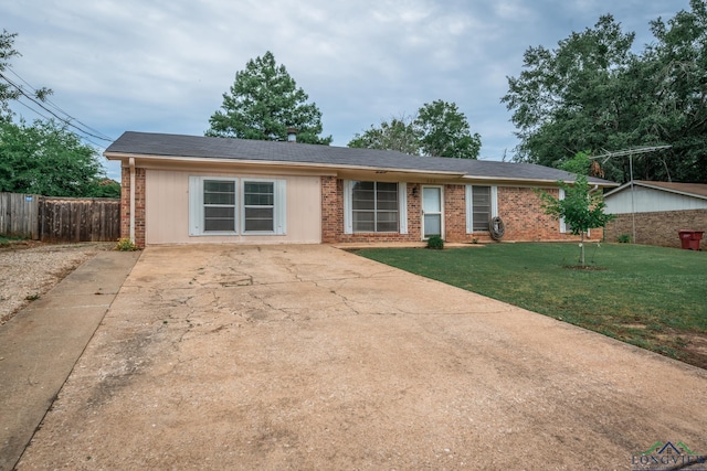 ranch-style house with a front lawn