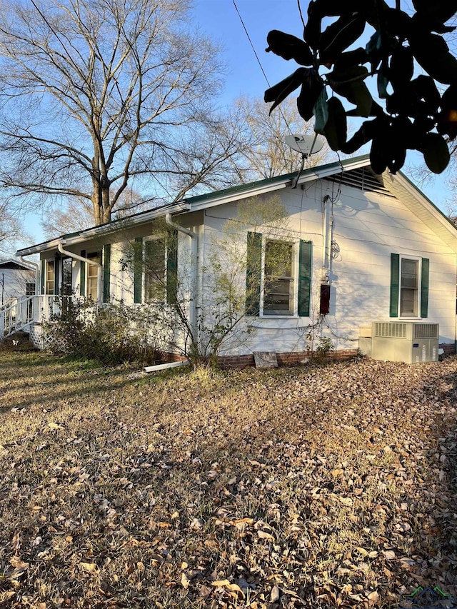 view of home's exterior with central AC unit